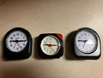 (2) Sharp Mini Clocks - Battery Power, Alarm, On Demand Backlight. Fixed Price $12.00.